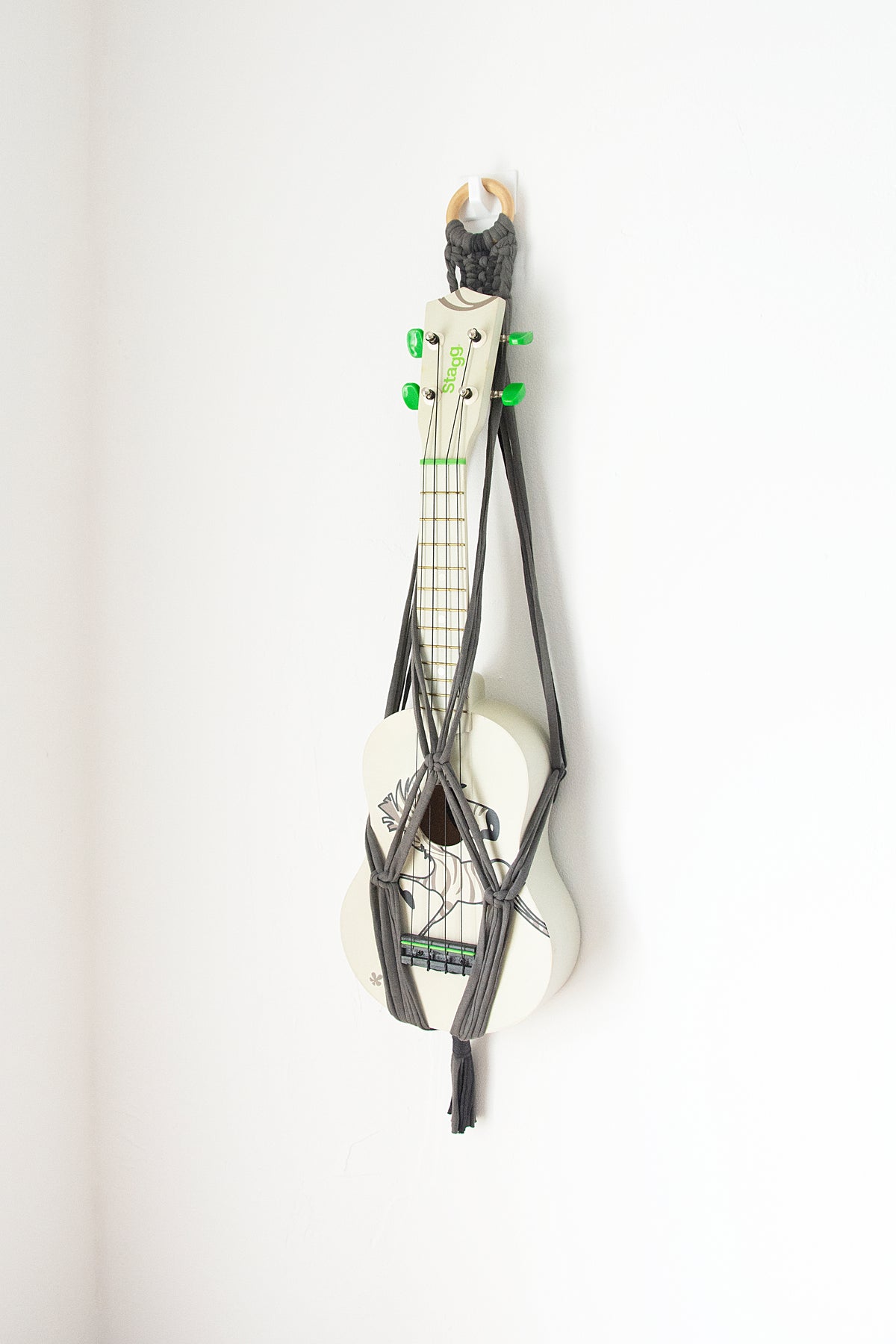 Grey ukulele hanger