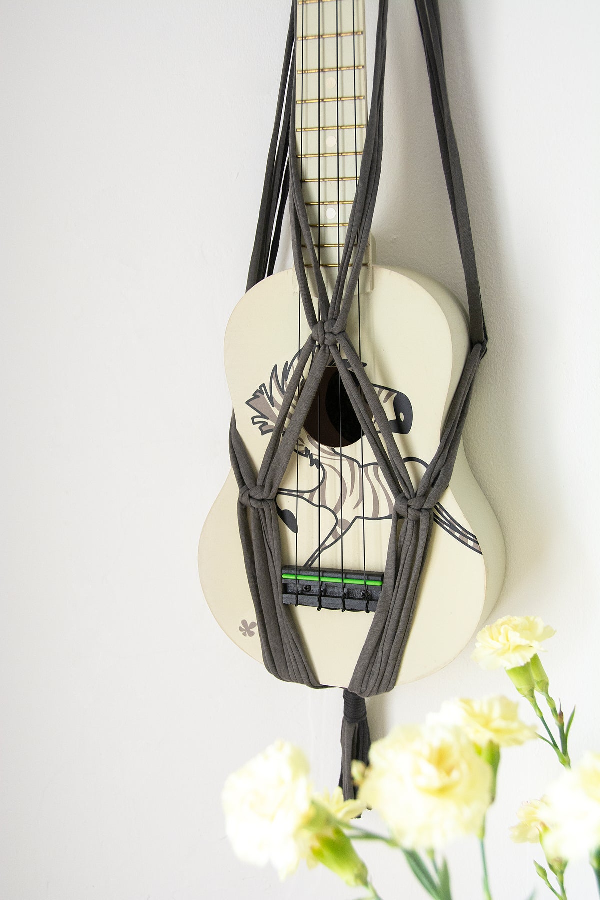 Grey ukulele hanger