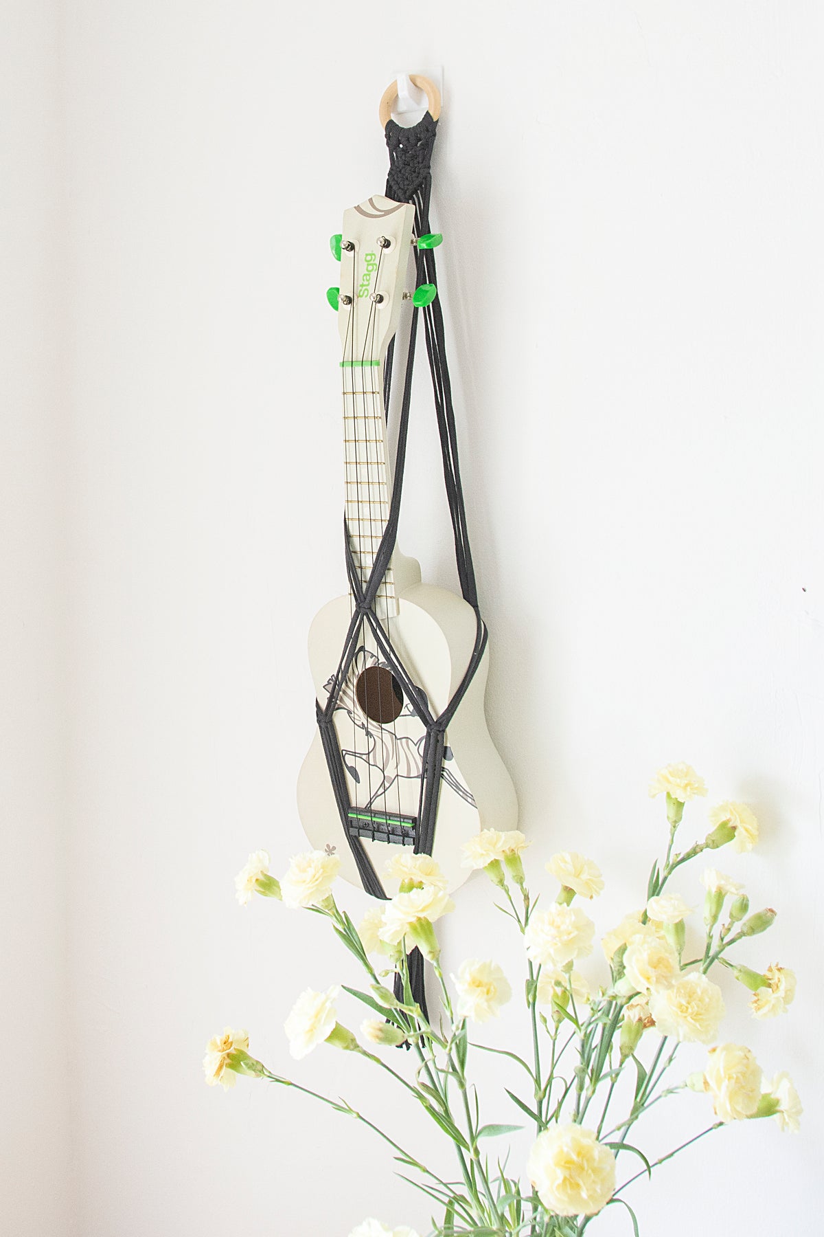 Grey hanger for ukulele